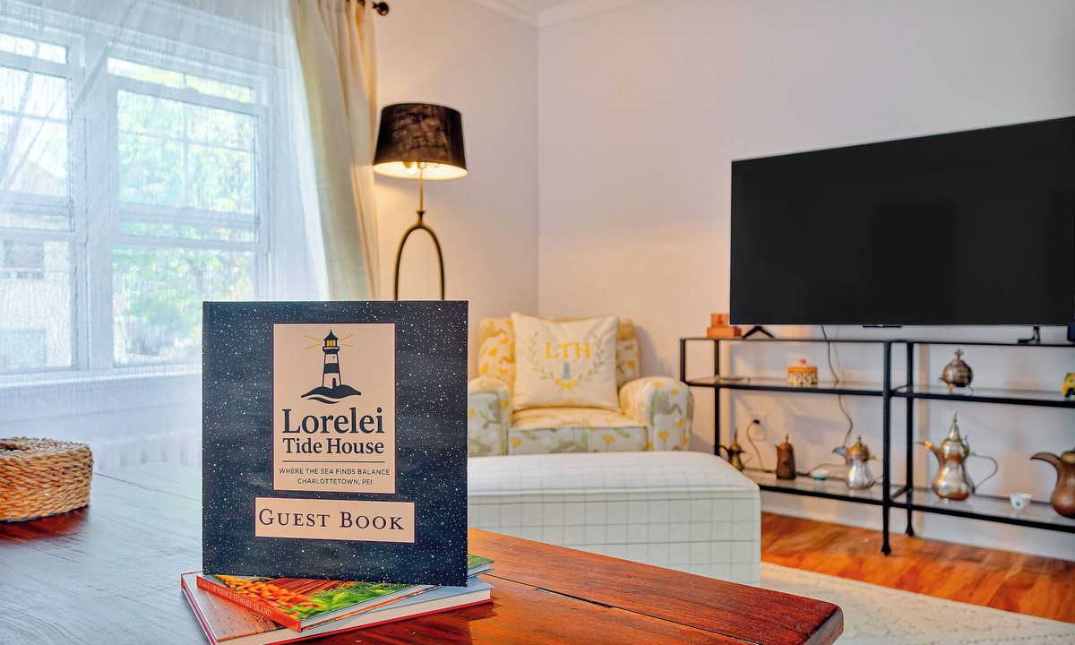 Queens Square House | Bright second-floor home with private deck, modern kitchen, and calm style.