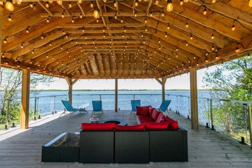 Carden House | Lakefront Retreat with Gazebo Fire Table & Fishing