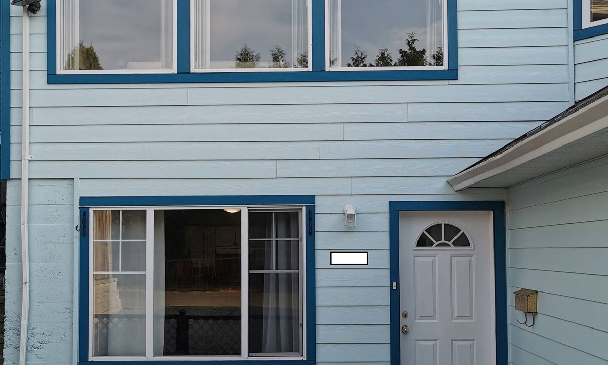 Saanich West House | Private 2 Bedroom Suite with one bed and a crib