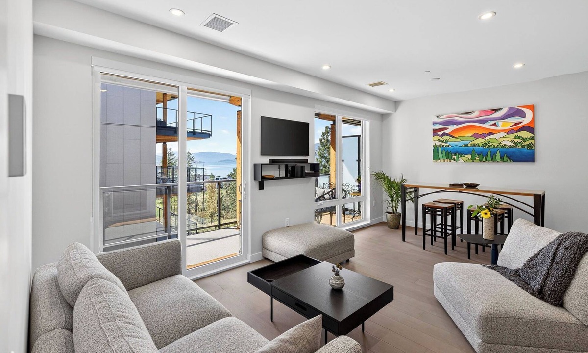 Central Okanagan Condo | Welcome to Zara at Lakestone! A premier lakeside community for a peaceful escape with pickleball courts, a gym, and a sauna. Modern 1BR condo with lake & mountain views, private patio seating.