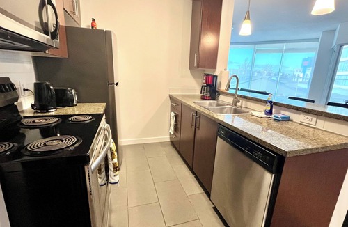 Crosstown Apartment | 1 bedroom + Sofabed, Private 500sqft sun deck, EV Parking w/Pool, Sauna, Hot Tub