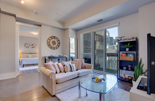 Wellington Place Apartment | Beautiful Condo with Gym, Rooftop Pool + Private Patio!