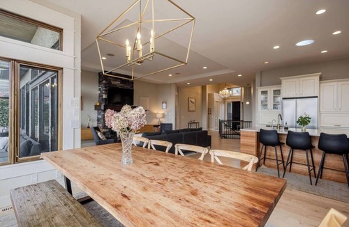 Southwest Mission House | Bright open-concept home in Kelowna with lake views, high ceilings, fireplace.