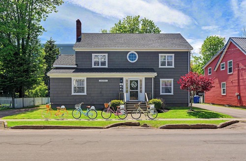 Queens Square House | Bright second-floor home with private deck, modern kitchen, and calm style.