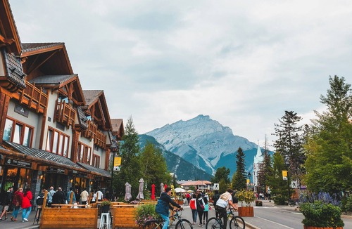 Banff Apartment | Chic King Room w/Balcony | Sauna & Hot Tub Access