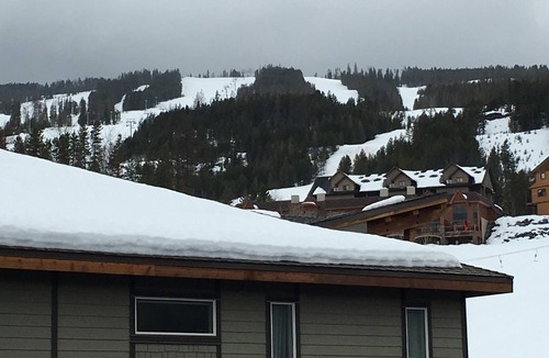 East Kootenay Condo | Condo with a mountain view from private hot tub at the base of the ski hill