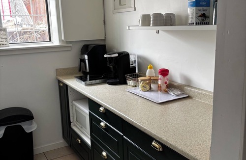 Cedarbrae House | Cozy basement suite w/fireplace. Pet friendly!