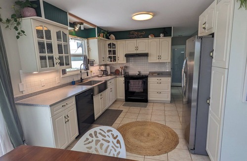 Colwood House | Cozy main floor suite with a breathtaking view.