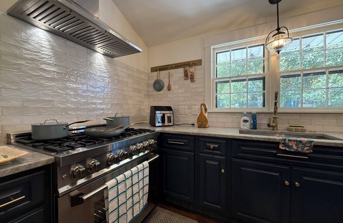 Raleigh House | French Country Retreat in North Hills, Fenced Yard, Game Room