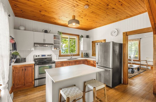 Mansonville House | Heritage home with spa, EV charger and walkable village