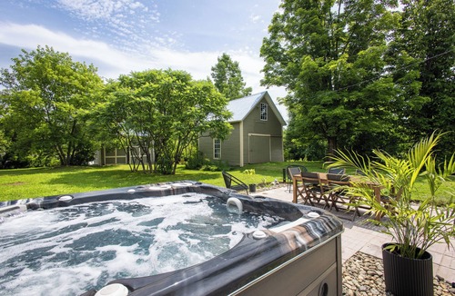 Mansonville House | Heritage home with spa, EV charger and walkable village