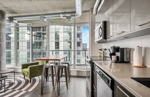 East Village Apartment | Industrial 1BR w Office, Views, AC, XL Patio