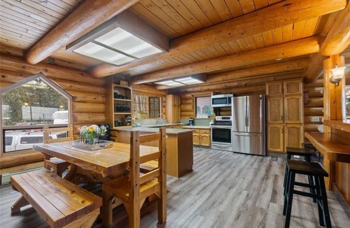 Magna bay Ski Chalet | Lakeview log cabin for family fun - up 20 guests! Beach access, buoy, hot tub.