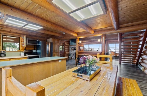 Magna bay Ski Chalet | Lakeview log cabin for family fun - up 20 guests! Beach access, buoy, hot tub.