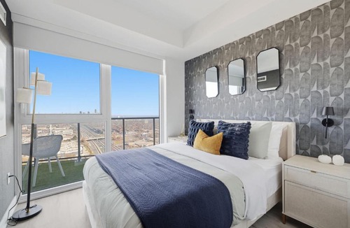 The Queensway Apartment | Modern 2BR Retreat with Private Balcony & Parking
