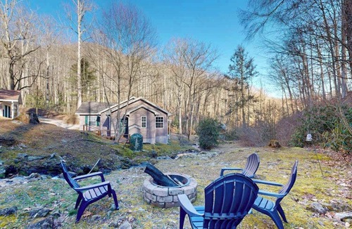 Sylva House | Mountain view home with a fireplace with beautiful view of the creek