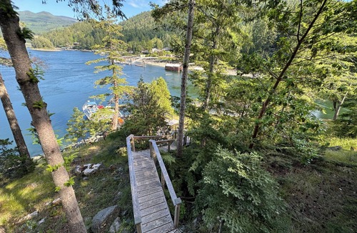 Garden Bay House | Oceanfront property in Pender Harbour with a dock, wrap around balcony with view