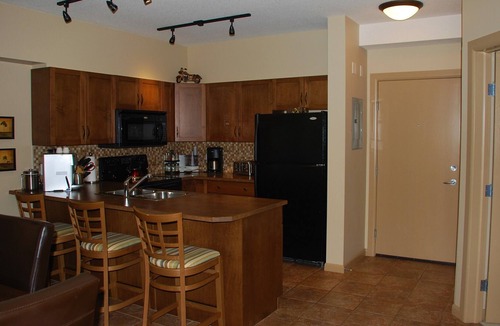 South Pandosy Condo | Perfect for families - 2 Bedroom with den, Ground floor walks out to grassy area