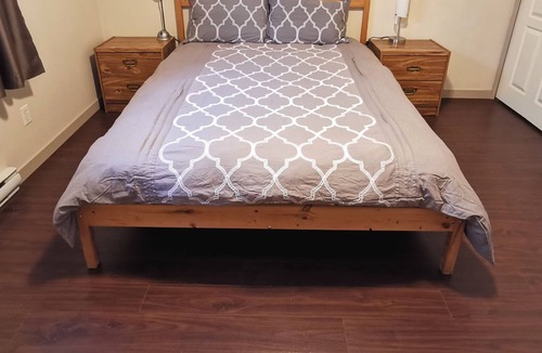Saanich West House | Private 2 Bedroom Suite with one bed and a crib