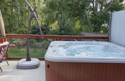Duncan House | Private Hot tub on beautiful deck facing the gardens and tree's.