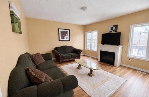 Brampton House | Private Queen Bedroom with Walk-In Closet, TV & Mini Fridge in Brampton Shared Home - 3 Baths, Full Kitchen, WiFi, Laundry & Deck - Near GO Station, Ideal for Work & Study!