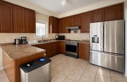 Brampton House | Private Queen Bedroom with Walk-In Closet, TV & Mini Fridge in Brampton Shared Home - 3 Baths, Full Kitchen, WiFi, Laundry & Deck - Near GO Station, Ideal for Work & Study!