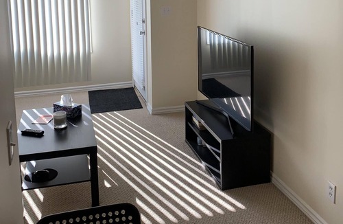 Panorama Hills House | Private suit In a pleasant garden setting, a king bed