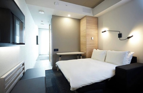 Brossard Hotel | Stay Steps Away from Shopping & Dining in Functionally Designed Room | 3 Units