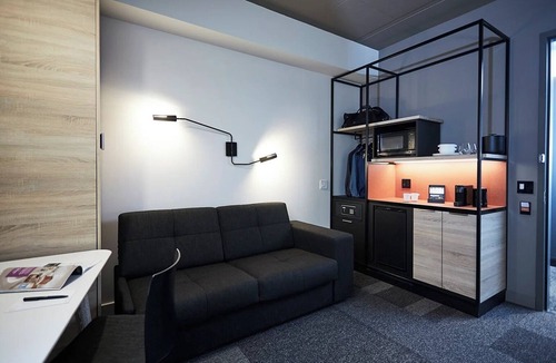 Brossard Hotel | Stay Steps Away from Shopping & Dining in Functionally Designed Room | 3 Units