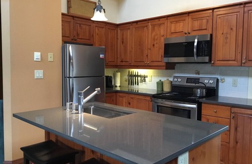 Mont-Tremblant Condo | Tremblant, ski in/out, 4 bedroom, sleeps 8, big pool, 2 decks + fire pit + pond