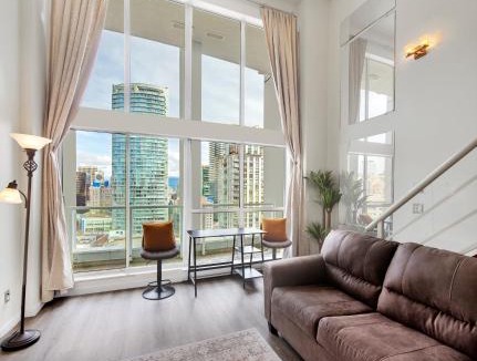 Downtown Vancouver Apartment | Two-Story Loft with a High-rises view and Rooftop Deck