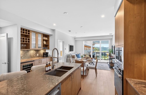 Central Okanagan Condo | Welcome to Zara at Lakestone! A premier lakeside community for a peaceful escape with pickleball courts, gym, & sauna. Relax in a stylish condo retreat at Zara Lakestone. Features: private patio w/BBQ & workspace.