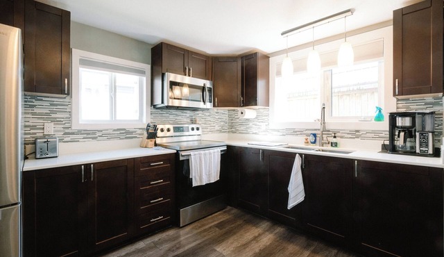 10 minutes to downtown or the beach! Stylish home with large backyard and deck.