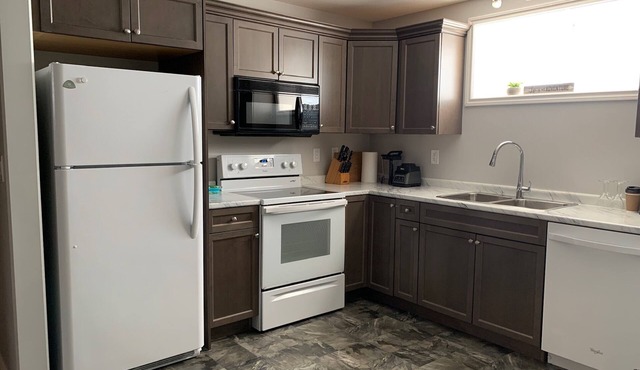 BEAUTIFUL 2 Bedroom Suite Close To The Airport minutes from downtown/hospital.