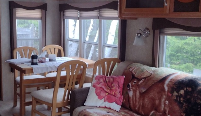 Beautiful location right on the river bank , steps down to the shore and fishing