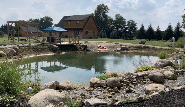 Cabin with private sand beach and swimming pond