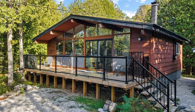 Escape to Stone & Timber: A private forest retreat on nearly 4 acres between Tobermory and Lion's Head. Enjoy vaulted ceilings, a cozy wood stove, private walking trails, and easy access to hiking, beaches, boat launches, and Dark Sky stargazing.