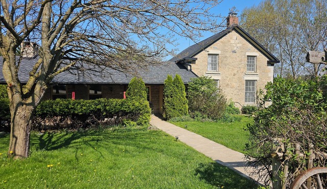 Large stone house with hot tub pond, secluded acerage, up to three families