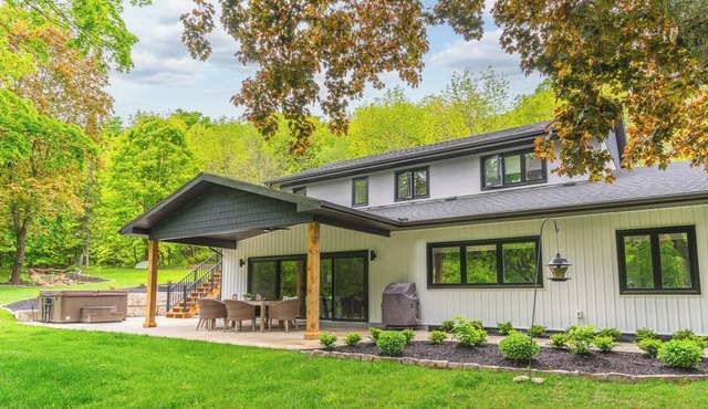 Modern Green Oasis in private setting, covered patio with hot tub and fire pit!