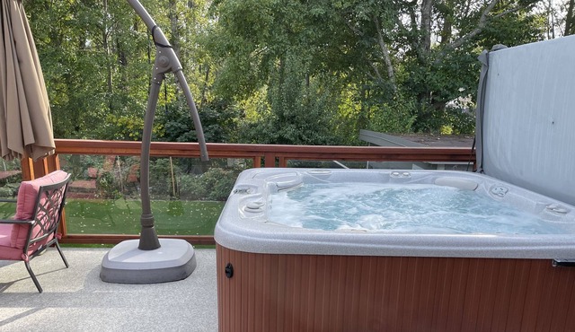 Private Hot tub on beautiful deck facing the gardens and tree's.