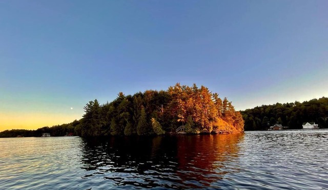 Private island on Lake Rosseau in Muskoka: beautiful cottage plus log cabin.