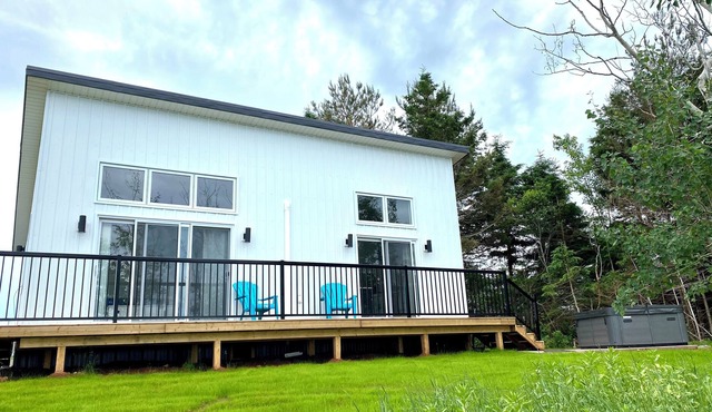 Rivers End Retreat located on cascumpec river. Private hot tub and bunk house.