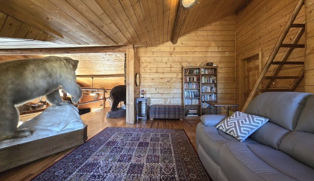 Room 5 at the Main Lodge with a queen bed and single bed.