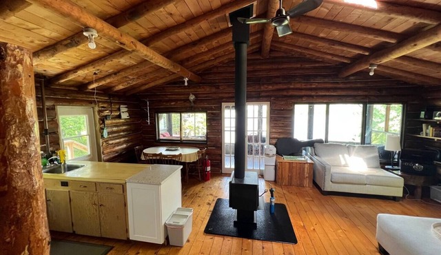 Rustic Log Cottage in Woodchuck Bay on Lake of the Woods with a Sand Beach