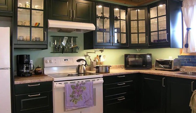 Sought-after 2-bedroom boathouse apartment right on the Gull Rivern