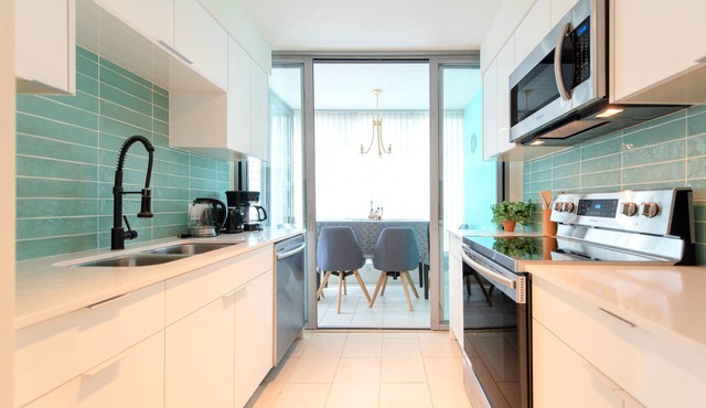 Stunning 2-Bedroom Downtown Apartment with Water Views & Gym Access