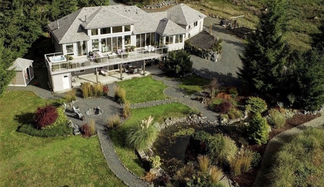 Stunning open style home set on 3 acres in the Seaside hamlet of Jordan River.