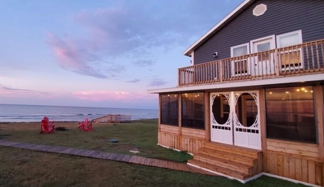 Three Bedroom Home With Screened In Porch Only Steps Away From North Shore Beach