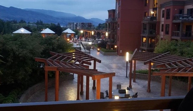 View of a courtyard with a pool and view of the mountains