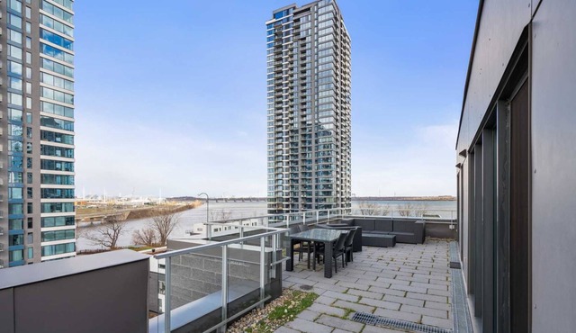 Waterfront penthouse with 1000 square feet patio